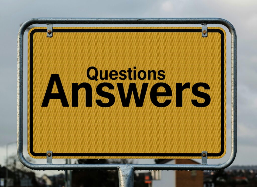 pexels-photo-208494-208494 Yellow sign with text questions and answers suggesting direction in decision-making.