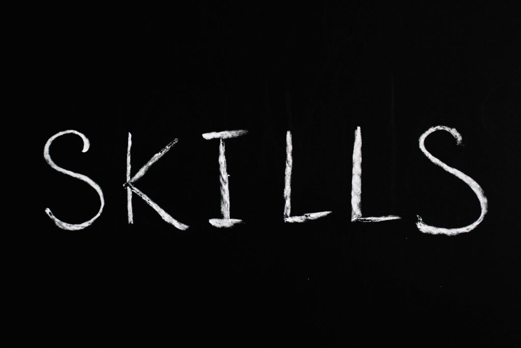 pexels-photo-5598301-5598301 Chalk lettering of the word 'skills' on a blackboard, emphasizing learning and education.