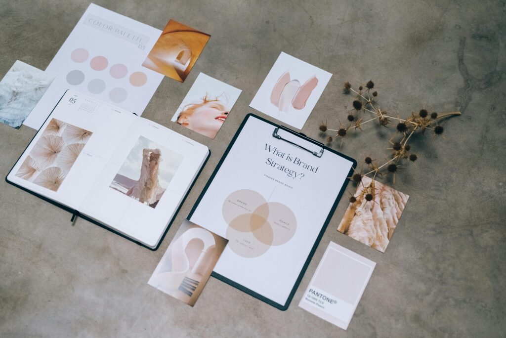 pexels-photo-7598019-7598019 Flat lay of branding strategy materials with moodboard and color palette for creative design.